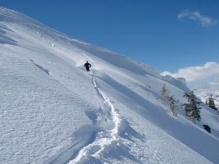Ahh yes... Spring skiing!  Billy D maching off the top of some mountain in Utah.